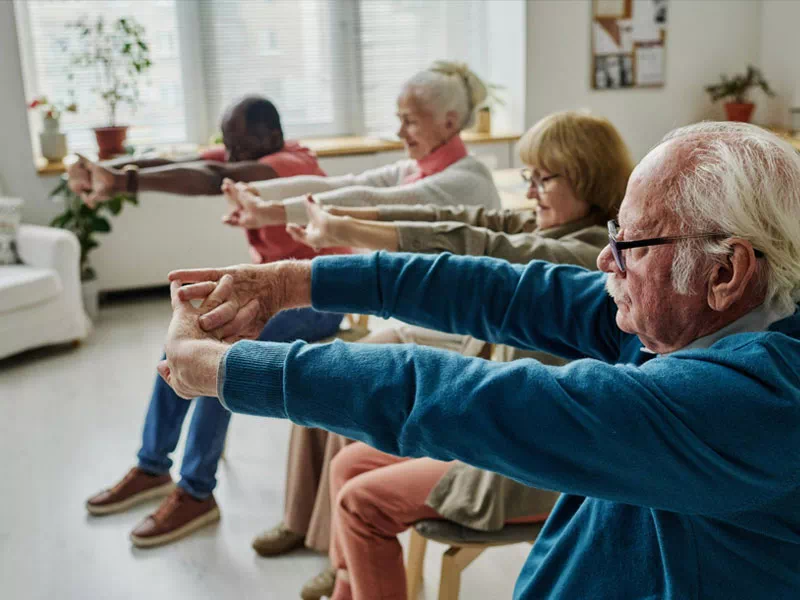 mindful-movements.org-program-seniors-p2-older-group-exercise-in-morning-room-elder-females-males