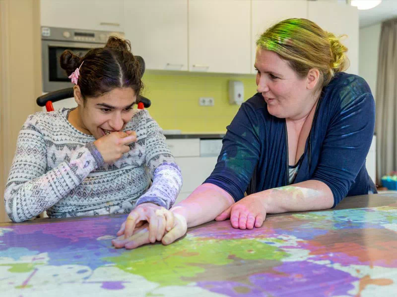 mindful-movements.org-program-special-needs-p2-young-adult-female-plays-interactive-table-top-game